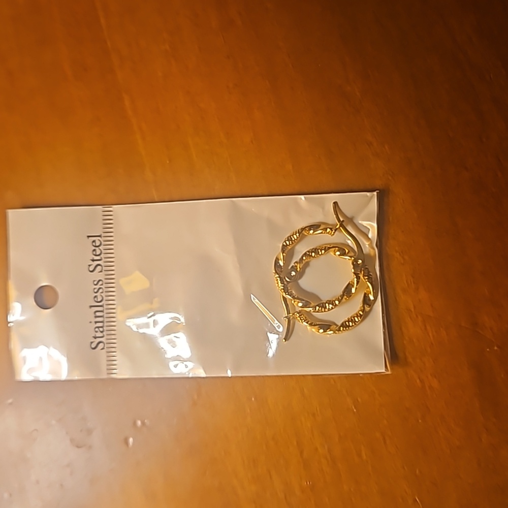 Stainless steel, gold plated hoop earrings.